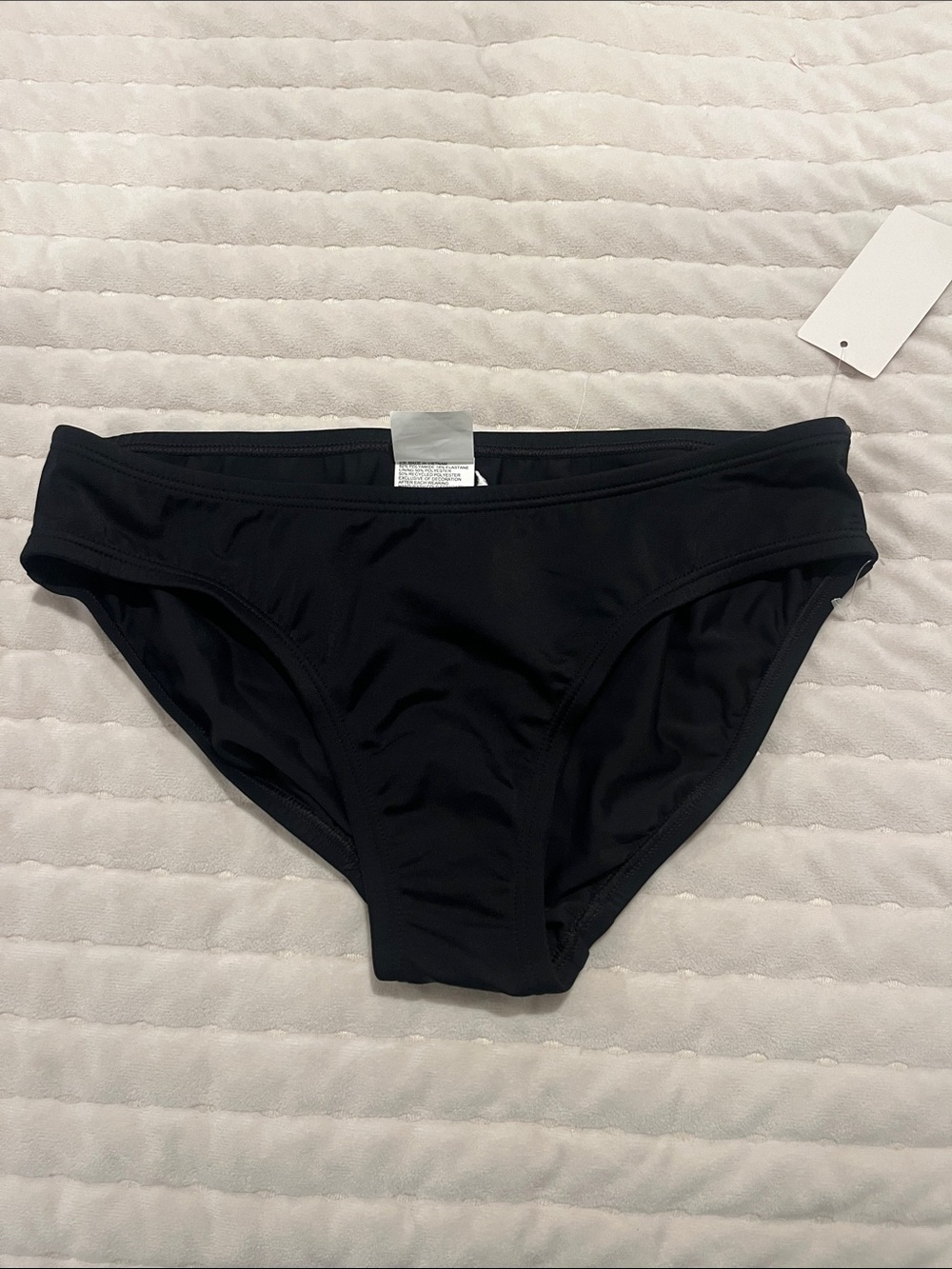 Nike Black Swim Brief with White Swoosh Accent - Picture 2 of 5